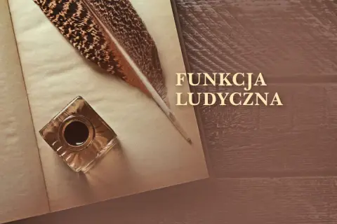 Pióro i kałamarz na otwartej księdze, symbolizujące funkcję ludyczną pisania i tworzenia.